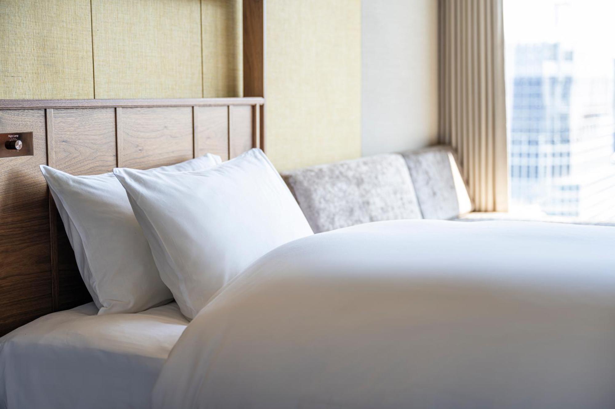 Candeo Hotels Osaka The Tower Номер фото A bed with pillows